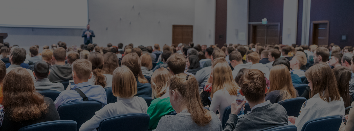 Image of a conference that takes place in a large conference room, workshop for young professionals, training in a large conference room, adult training